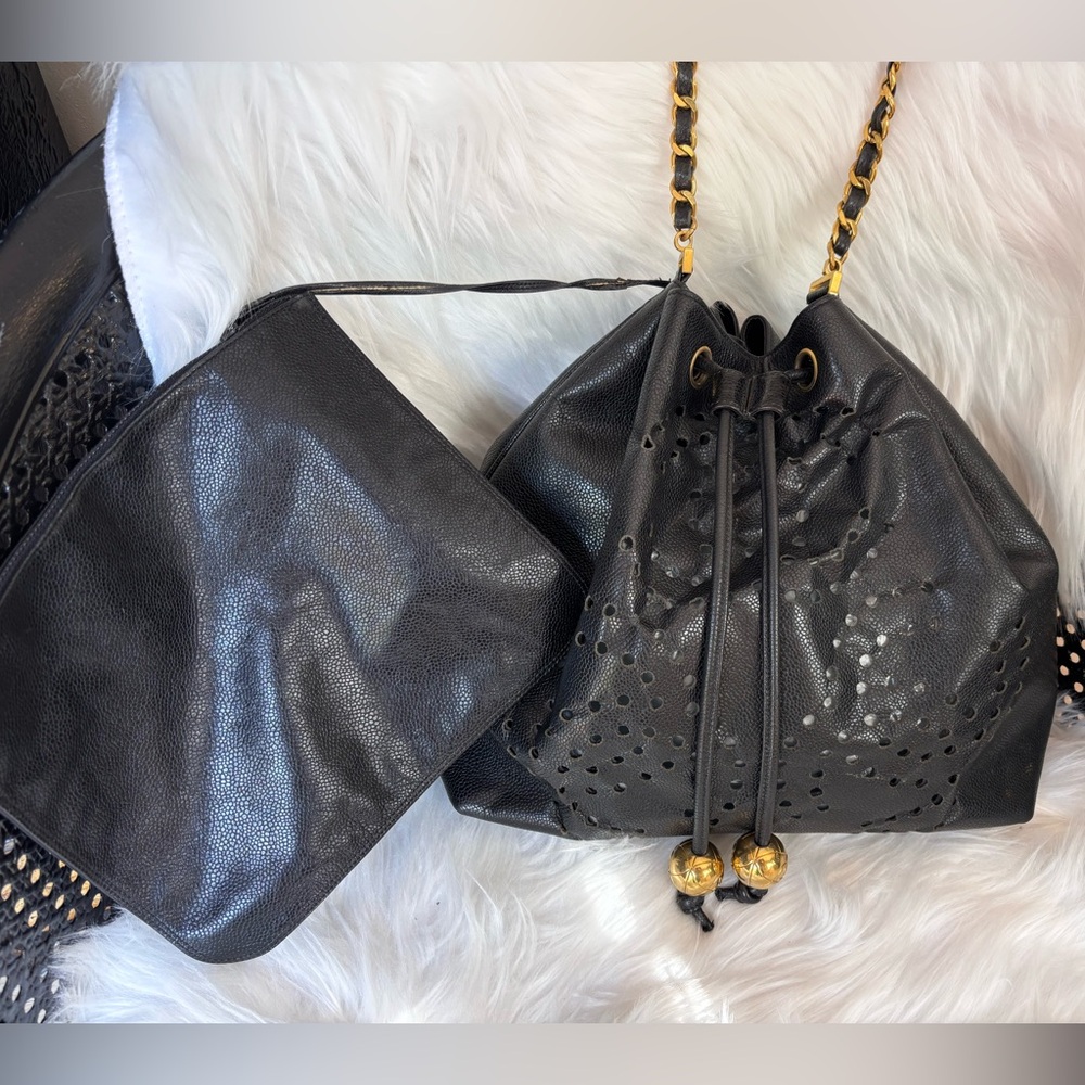 Authentic CHANEL perforated bucket black leather with pouch